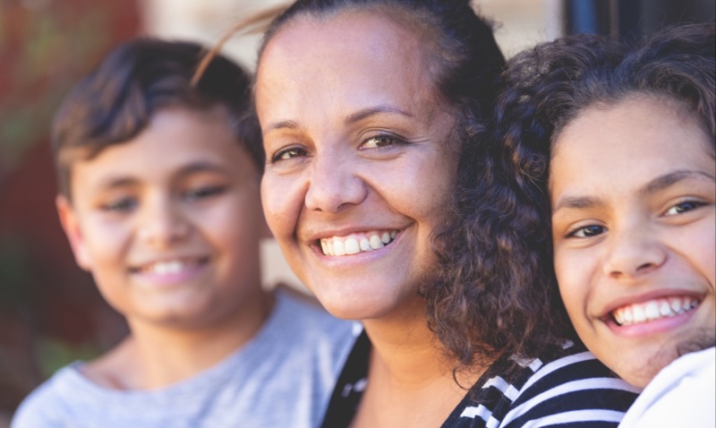 Are you at risk of type 2 diabetes: young family of three looking at the camera and smiling