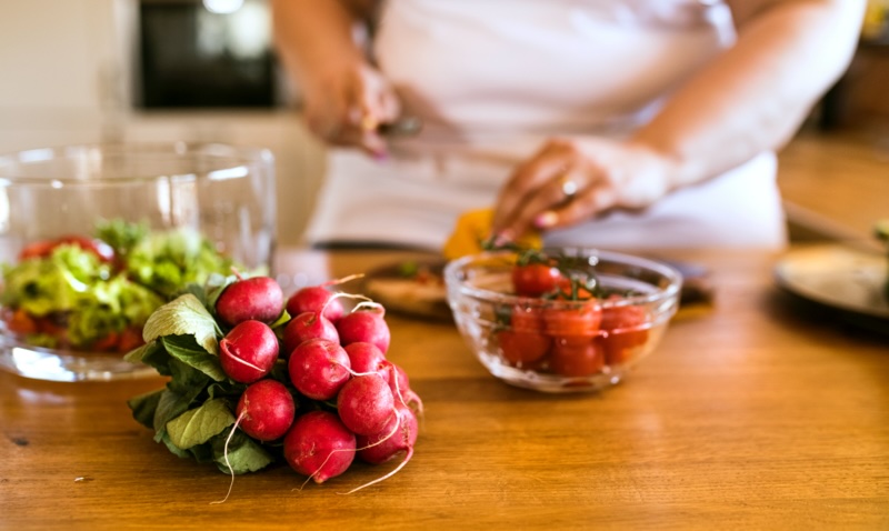 Woman preparing healthy food in the kitchen