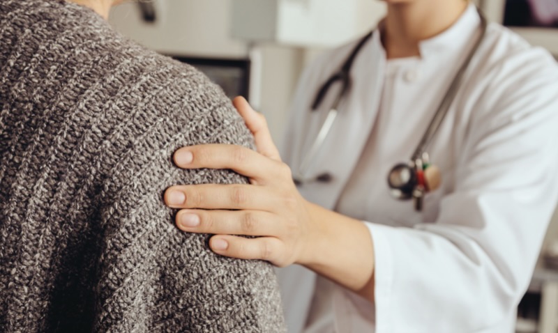 A doctor speaking to a patient: regular check-ups with your healthcare team are an important part of managing type 2 diabetes