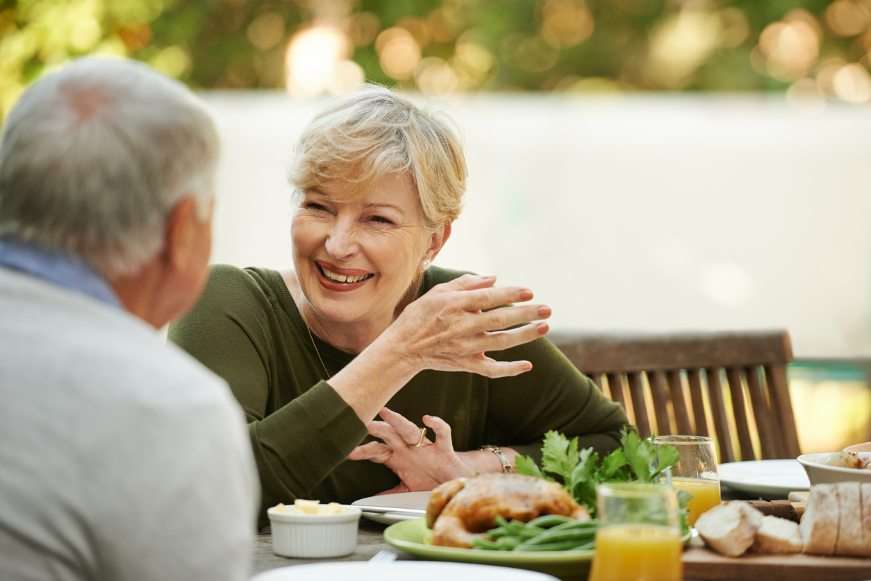 Two people talking over a meal