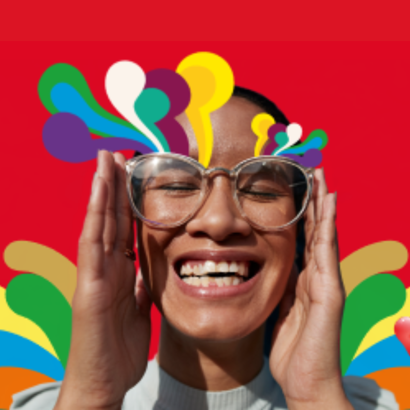 Woman smiling while holding glasses