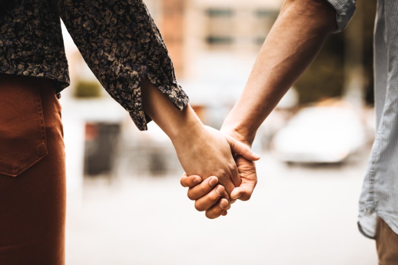 Young couple holding hands