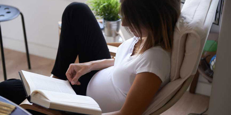 Pregnant woman on couch Pregnant woman on couch