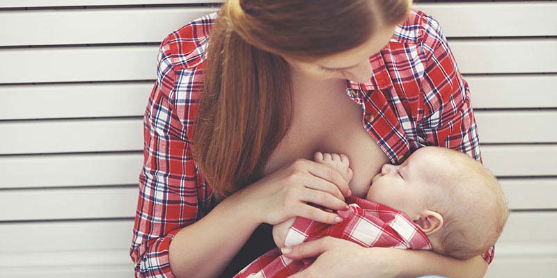 A mother breastfeeding her baby A mother breastfeeding her baby