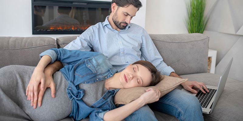 A pregnant woman resting on the couch A pregnant woman resting on the couch