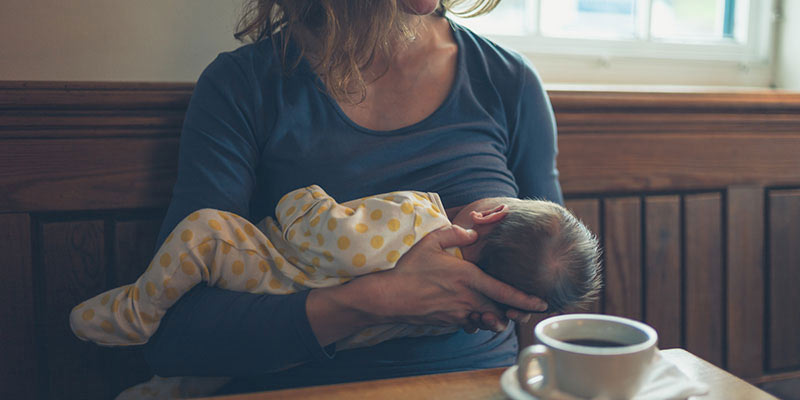 A mother breastfeeding her baby A mother breastfeeding her baby