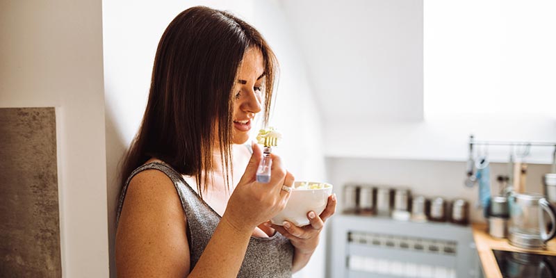 A woman eating her breakfast A woman eating her breakfast