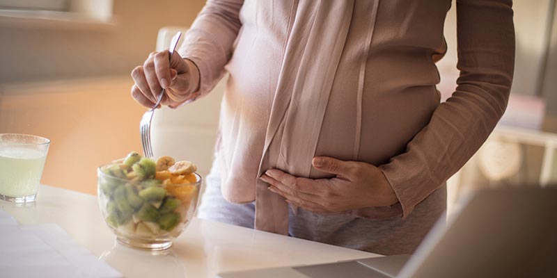 pregnant woman eating healthy food pregnant woman eating healthy food