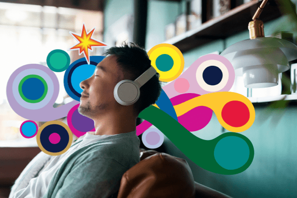 Young man listening to music on headphones
