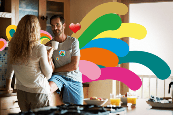 Man and woman having breakfast in kitchen