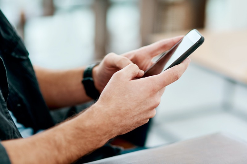 Male using smart phone