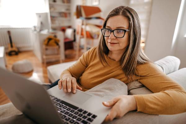 A woman researching on her laptop