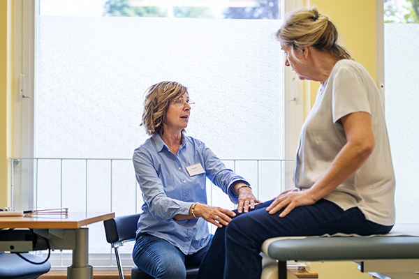 doctor checking a patient's knee