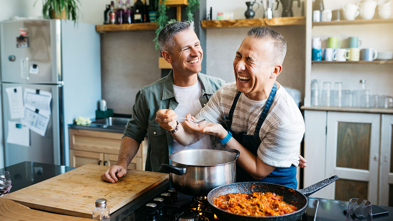 2 men cooking in the kitchen 2 men cooking in the kitchen