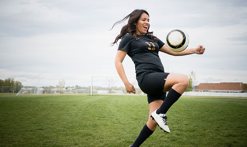 woman playing soccer woman playing soccer