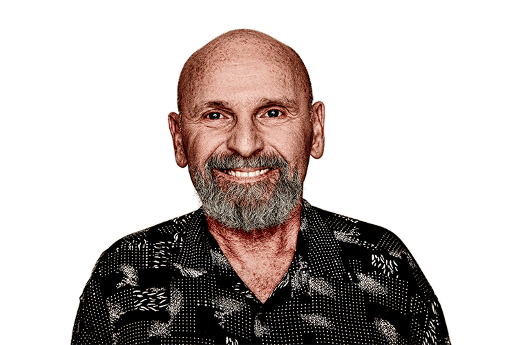 Older man with a beard smiling