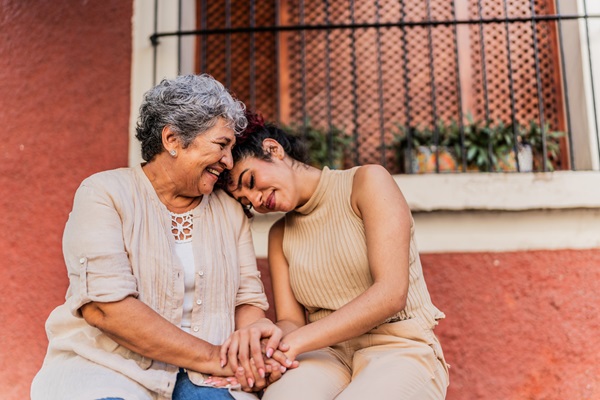1887400939 Grandmother and granddaughter together outdoors